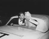 <p>Jayne Mansfield and Mickey Hargitay share one last newlywed kiss in front of their wedding guests as they leave their reception in Los Angeles. </p>