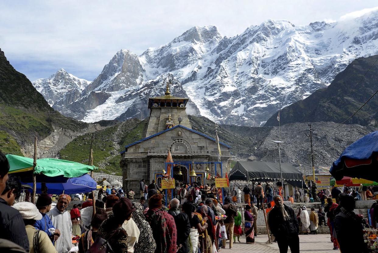 Hindu devotees worship at the Kedarnath Temple in the northern Indian state of Uttarakhand. <a href="https://www.gettyimages.com/detail/news-photo/in-this-photograph-taken-on-june-16-indian-hindu-devotees-news-photo/698321918?adppopup=true" rel="nofollow noopener" target="_blank" data-ylk="slk:Shammi Mehra/AFP via Getty Images;elm:context_link;itc:0;sec:content-canvas" class="link ">Shammi Mehra/AFP via Getty Images</a>