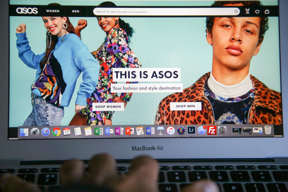 LONDON, UNITED KINGDOM - 2018/12/17: A woman is seen shopping on ASOS the online fashion store on a laptop. Shares in Asos tumbled nearly 40 per cent on Monday morning after the online fashion retailer warned of weak profits this financial year after "unprecedented" discounting hit its trading in November. (Photo by Dinendra Haria/SOPA Images/LightRocket via Getty Images)