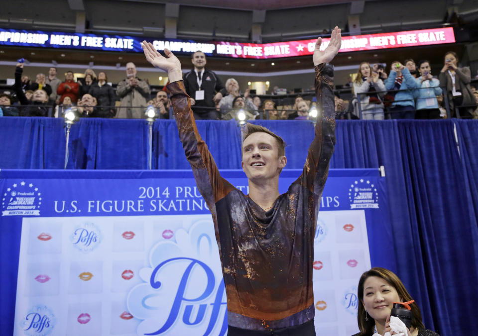 Jeremy Abbott celebrates after learning his score for the men's free skate at the U.S. Figure Skating Championships Sunday, Jan. 12, 2014 in Boston. (AP Photo/Steven Senne)