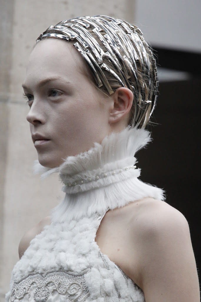 From ethereal white lashes to graphic sci-fi visors, a look back at the romantic beauty ideas on Sarah Burton's Alexander McQueen runway.