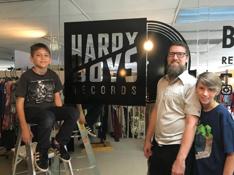 Dean Hardy and his sons, Thaddeus and Caspian at Hardy Boys Record and Comics shop.