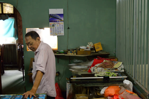 Mr Lau has worked in the studio for 45 years, but keeps with times as he now uses an Apple Macbook Pro to edit his photos.