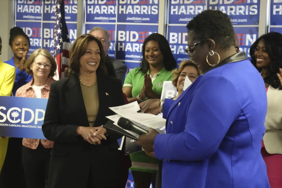 Vice President Kamala Harris, left, smiles as South Carolina Democratic Party Chair Christale Spain accepts President Joe Biden’s paperwork to appear on South Carolina’s 2024 Democratic presidential primary, on Friday, Nov. 10, 2023, in Columbia, S.C. (AP Photo/Meg Kinnard)