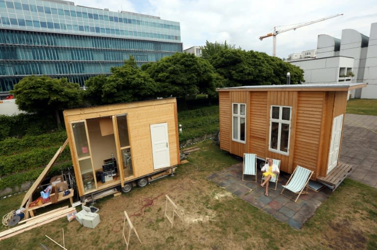 The Tiny Houses Project's construction site, with cafe (L) currently being built as well as a small house (R), an experiment in providing housing to people in need