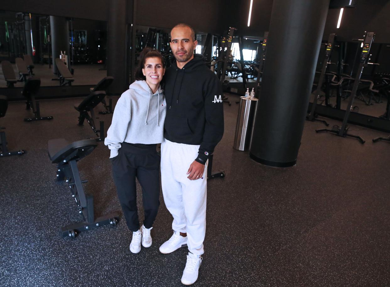 Kati Rodriguez and husband Nik on Tuesday, Nov. 16, 2021 at their new fitness business, Train Moment, a "strength-forward" fitness facility in the Third Ward at 323 North Milwaukee St. This is the second location for their business that originated in Chicago's West Loop. The business offers full-body group workouts. While the lobby is white and simple with greenery, the training room has a drastically different vibe. It's all black with dim lights and blackout blinds.