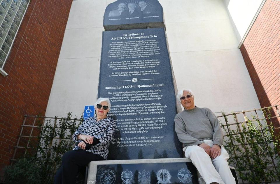 American National Committee to Aid the Homeless Armenians (ANCHA) chair Sophia Matewosian Mekhitarian, left, and co-chair Varoujan Der Simonian, right, seen next to the 13-foot monument that will honor profiles in Armenian history and dedicated in a ceremony Sunday, April 16 at Holy Trinity Armenian Apostolic Church. The public is invited to the ceremony which will be followed by a reception. Photographed Wednesday, April 12, 2023 in downtown Fresno.