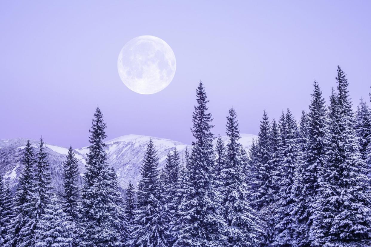 Full moon over snowfall