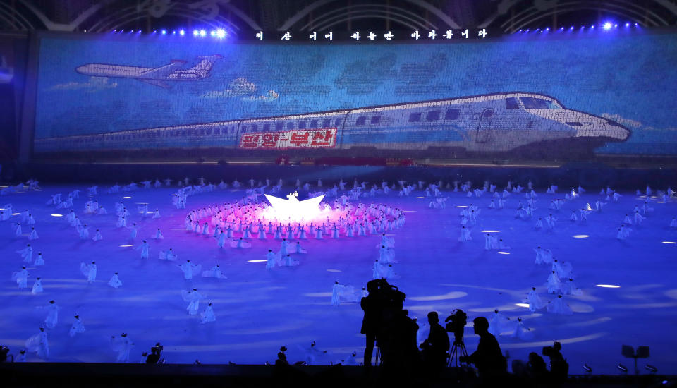 North Koreans perform during the mass games performance of "The Glorious Country" at May Day Stadium in Pyongyang, North Korea, Wednesday, Sept. 19, 2018. The letters read "Pyongyang-Busan." (Pyongyang Press Corps Pool via AP)
