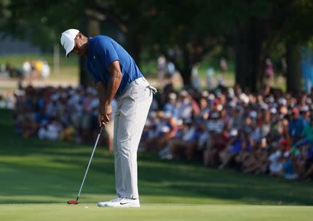 Aug 11, 2018; Saint Louis, MO, USA; Tiger Woods putts on the 18th green during the third round of the PGA Championship golf tournament at Bellerive Country Club. Mandatory Credit: Jerry Lai-USA TODAY Sports