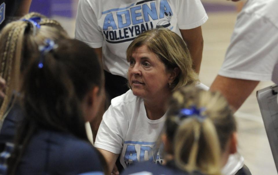 Adena volleyball coach Laura Smith talks to her players during a timeout in the Warriors' match against the South Webster Jeeps in the Division III regional semifinals at Logan High School on Nov. 2, 2023, in Logan, Ohio.