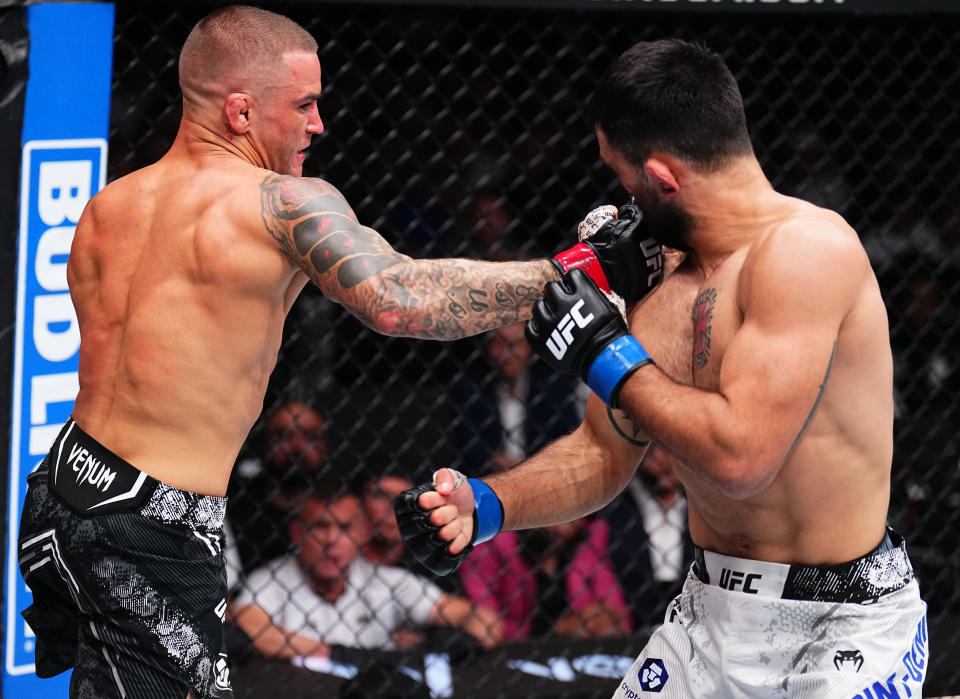 MIAMI, FLORIDA – MARCH 09: (L-R) Dustin Poirier punches Benoit Saint Denis of France in a lightweight bout during the UFC 299 event at Kaseya Center on March 9, 2024 in Miami, Florida.  (Photo by Chris Unger/Zuffa LLC via Getty Images)