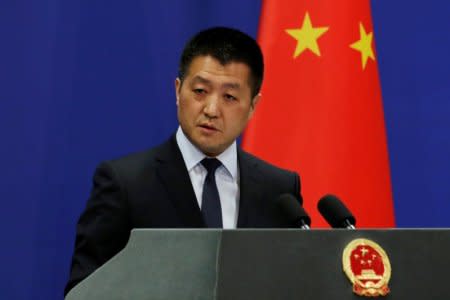 FILE PHOTO: Chinese Foreign Ministry spokesman Lu Kang answers questions about a major bus accident in North Korea, during a news conference in Beijing, China April 23, 2018.  REUTERS/Jason Lee/File Photo