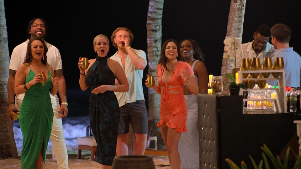 Photo of the Love is Blind season 6 couples meeting for the first time since leaving the pods and getting engaged. This is during their engagement trip to the Dominican Republic. From left: Brittney (green dress), Kenneth, Laura, Johnny, Amy, Ad, Clay, Jeramey. (Courtesy: Netflix / Everett Collection)
