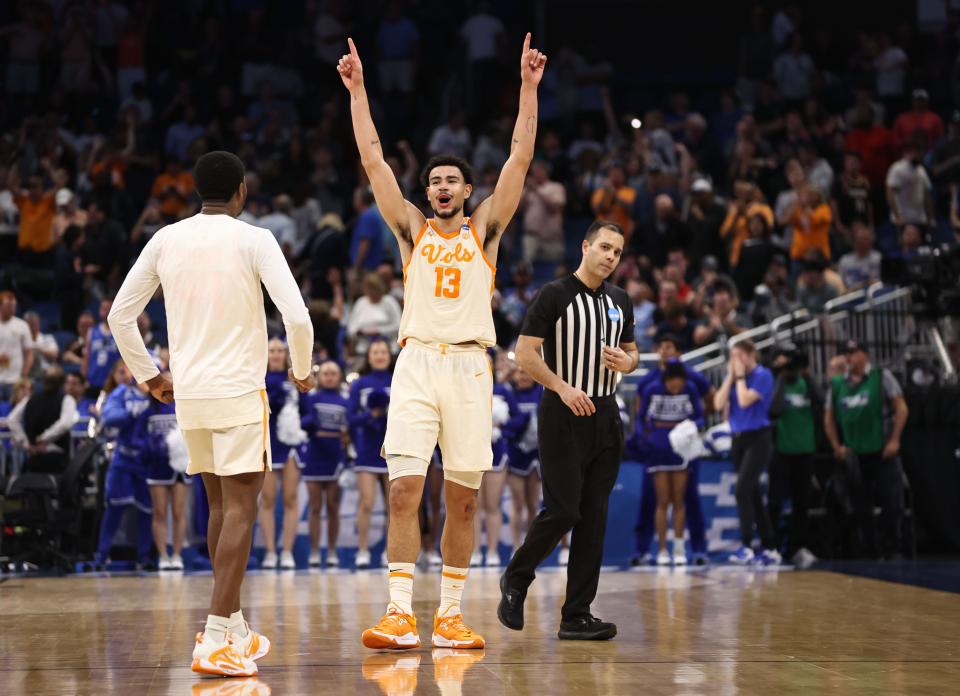Tennessee forward Olivier Nkamhoua (13) celebrates after defeating Duke in the second round of the 2023 NCAA men's tournament at Legacy Arena.