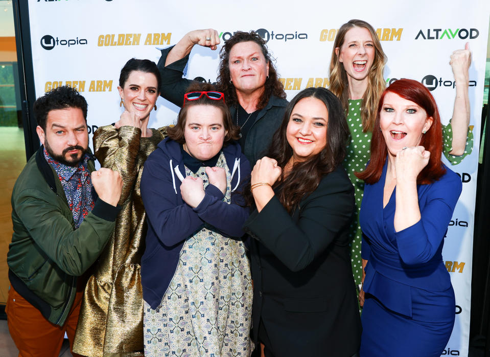 <p>Ahmed Bharoocha, Mary Holland, Betsy Sodaro, Dot-Marie Jones, Maureen Bharoocha, Dawn Luebbe and Kate Flannery show off their golden arms at the <em>Golden Arm</em> L.A. premiere on Monday. </p>