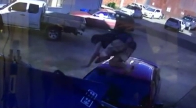 The man body-slams the car multiple times from above. Source: Daily Mercury