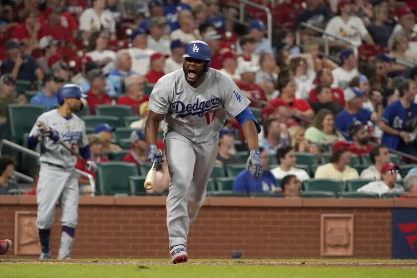 Los Angeles Dodgers' Hanser Alberto celebrates after hitting an RBI single during the ninth inning of a baseball game against the St. Louis Cardinals Wednesday, July 13, 2022, in St. Louis. (AP Photo/Jeff Roberson)