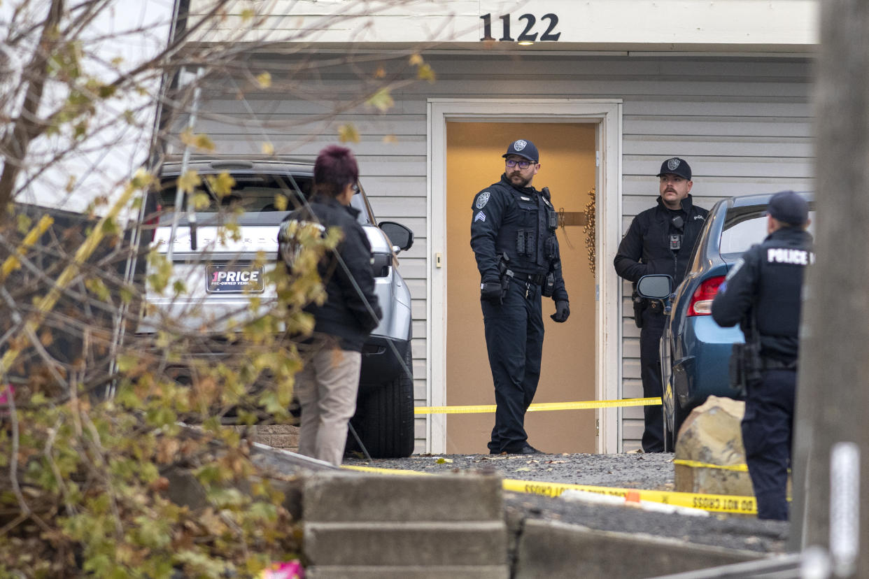 Officers investigate a homicide at an apartment complex south of the University of Idaho campus on Sunday, Nov. 13, 2022. (Zach Wilkinson / The Moscow-Pullman Daily News via AP file)