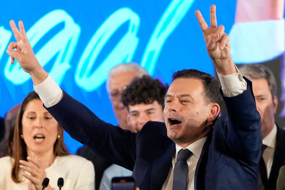 Luis Montenegro, leader of the center-right Democratic Alliance, gestures to supporters after claiming victory in Portugal's election, in Lisbon, Monday, March 11, 2024.