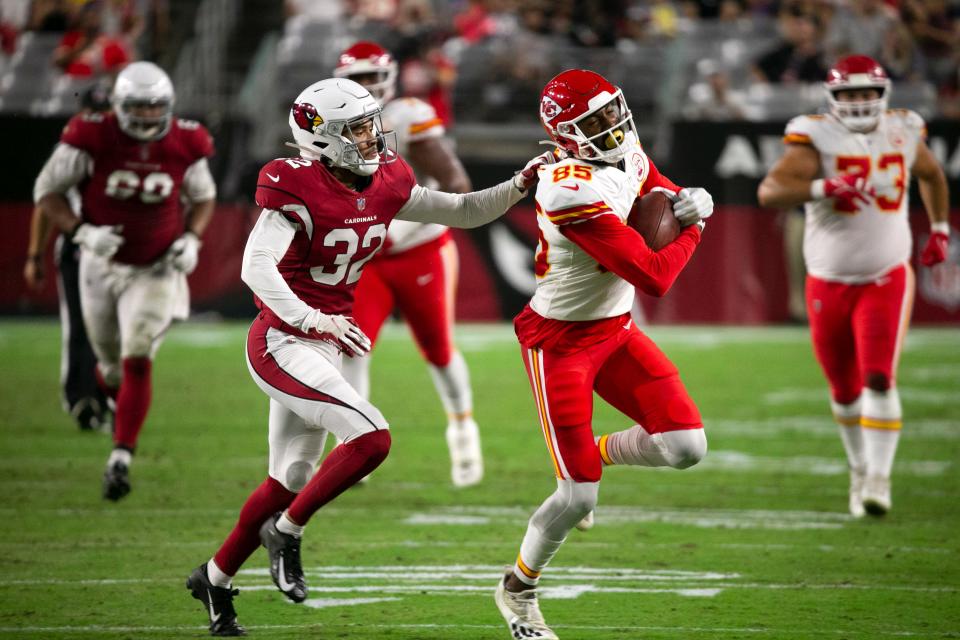 Chiefs wide receiver Marcus Kemp carries the ball as he is pursued by Cardinals defensive back Tay Gowan during the third quarter of the preseason game against the Chiefs at State Farm Stadium in Glendale on August 20, 2021.