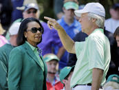 Former U.S. Secretary of State Condoleezza Rice speaks with Ben Crenshaw during the par three competition at the Masters golf tournament Wednesday, April 9, 2014, in Augusta, Ga. (AP Photo/David J. Phillip)