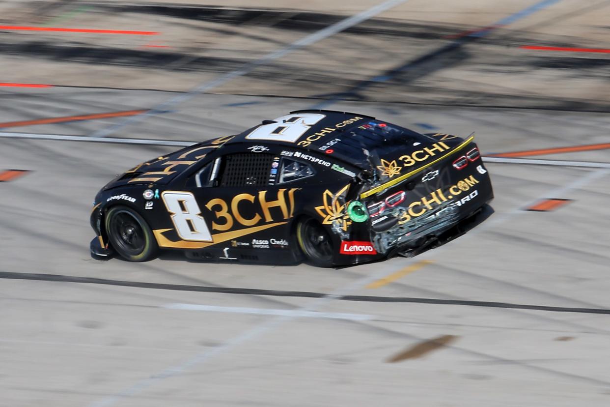 Kyle Busch limps back to the garage after crashing late in Stage 1 on Sunday at Texas.
