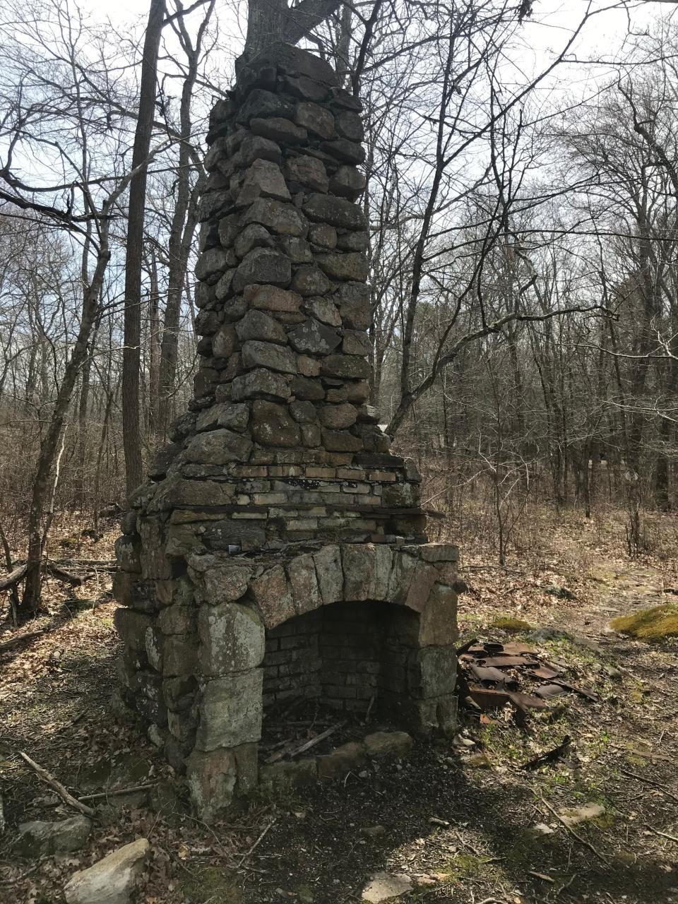 A chimney still stands on land formerly owned by Stuart Cruickshank, who sold 21 acres to the Girl Scouts in 1941 to start Camp Wahaneeta.