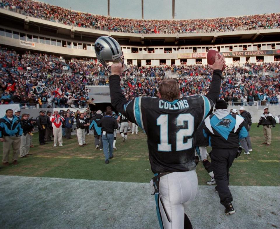 12/23/96 1B BOB LEVERONE/Staff Kerry Collins and the Panthers kept their record at their house -- at 800 S. Mint St. -- perfect this season, beating Pittsburgh 18-14 Sunday in the regular-season finale to go 8-0 at home in the opening season at Ericsson Stadium. (UNPUBLISHED NOTES:) (CHANDLER 12/22/96) Panther quarterback Kerry Collins(12) comes off the field at Ericsson in celebration. photo by bob leverone