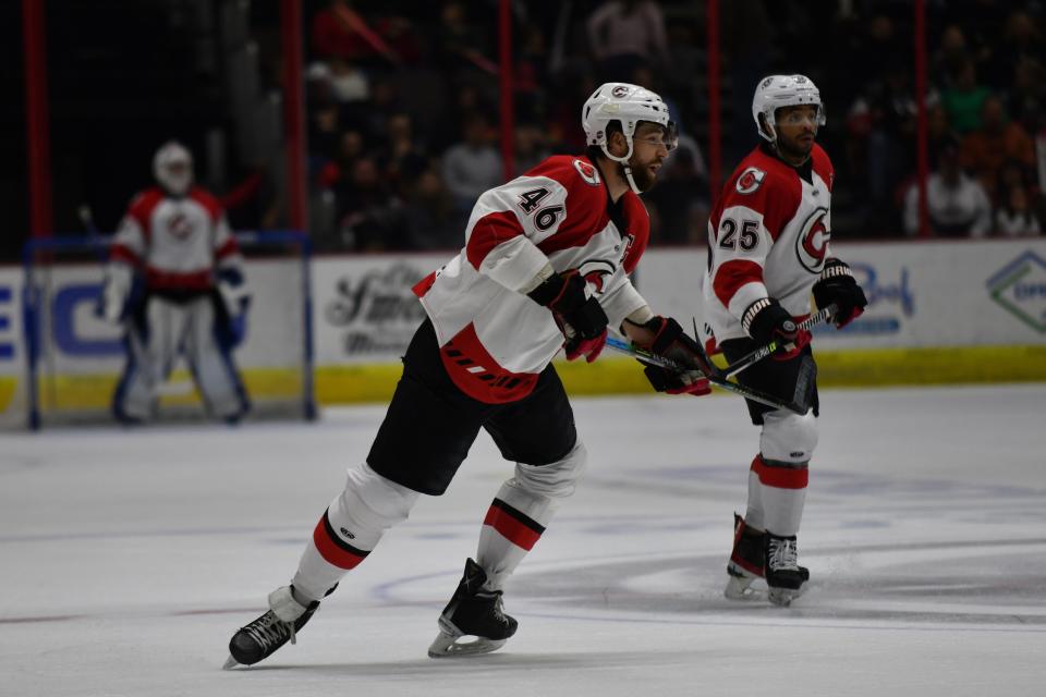 Double Trouble: Justin vaive 46, and Dajon Mingo 25 look downrink at the offense during the matchup between the Cincinnati Cyclones and the Iowa Heartlanders April 1, 2022 at Heritage Bank Center. Cincinnati beat the Heartlanders 4 - 2.