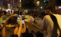 <p>Protesters work to remove the head of the statue of Egerton Ryerson. (Steve Russell/Toronto Star via Getty Images)</p> 