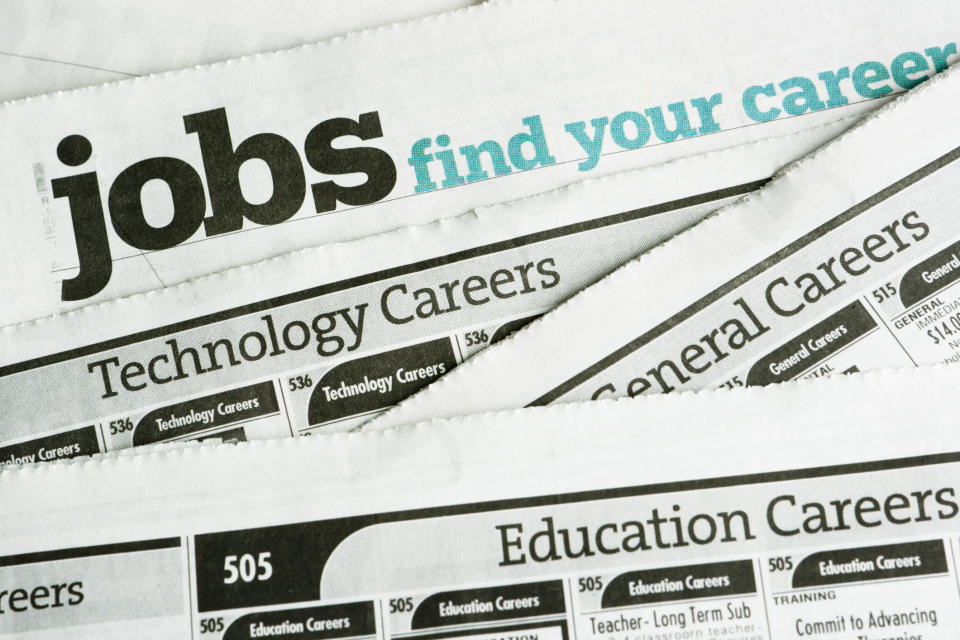 Assorted newspaper job listings with focus on "jobs find your career" headline