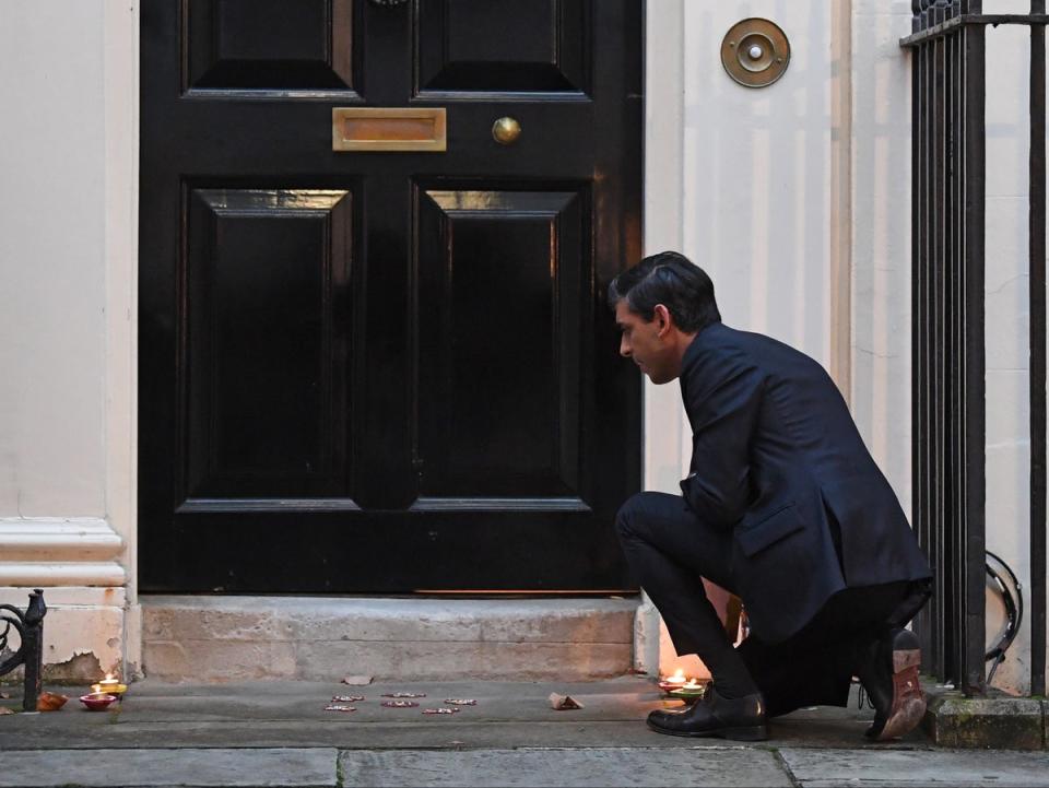 Lighting candles outside Downing Street ahead of Diwali celebrations (PA)