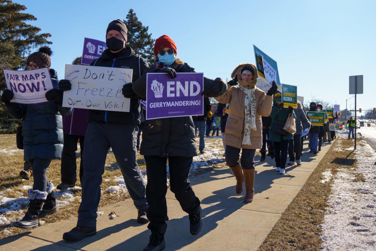 About 100 people attended a rally outside Menomonee Falls Village Hall on Jan. 21, seeking to end gerrymandering.