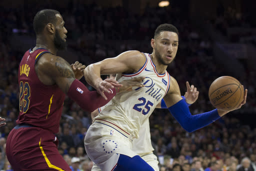 PHILADELPHIA, PA – APRIL 6: Ben Simmons #25 of the Philadelphia 76ers controls the ball against LeBron James #23 of the Cleveland Cavaliers in the first quarter at the Wells Fargo Center on April 6, 2018 in Philadelphia, Pennsylvania. (Photo by Mitchell Leff/Getty Images)