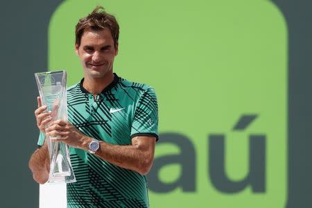 Apr 2, 2017; Key Biscayne, FL, USA; Roger Federer of Switzerland holds the Butch Buchholz trophy after his match against Rafael Nadal of Spain (not pictured) in the men's singles championship of the 2017 Miami Open at Crandon Park Tennis Center. Federer won 6-3, 6-4. Mandatory Credit: Geoff Burke-USA TODAY Sports