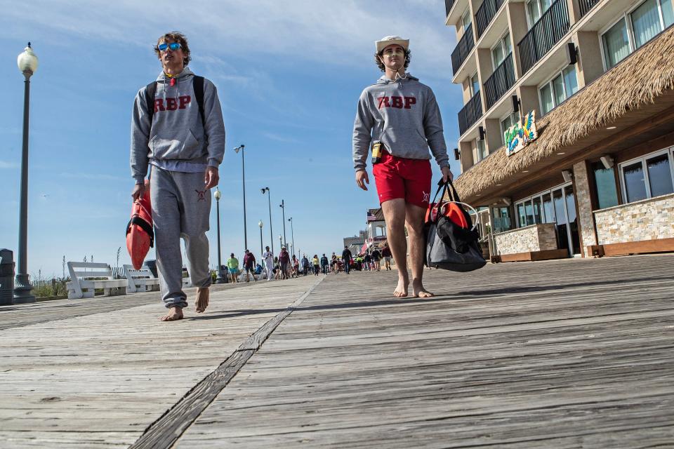 Members of the Rehoboth Beach Patrol stroll on the boardwalk on Saturday, May 27, 2023.