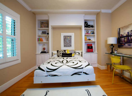 <body><p>Big or small, all rooms can benefit from the inclusion of a few small-space solutions. Interior designer Kerrie L. Kelly made this dining room convertible by introducing a Murphy bed. One weekend, the well-appointed room serves as <a rel="nofollow noopener" href=" http://www.bobvila.com/slideshow/10-ways-to-welcome-a-house-guest-46938#.VVoFH45Viko?bv=yahoo" target="_blank" data-ylk="slk:guest;elm:context_link;itc:0;sec:content-canvas" class="link ">guest</a> quarters; the next, with the bed all tucked away, it hosts a dinner party—genius! </p></body>