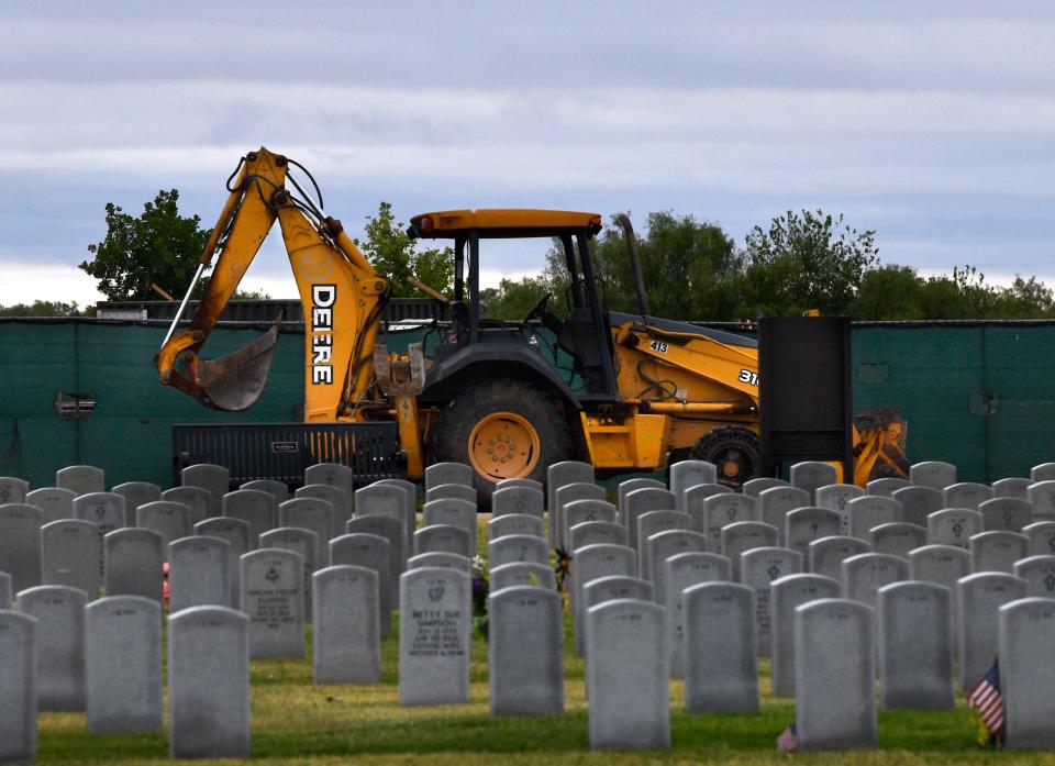 Construction equipment is parked on the entrance road to Texas State Veterans Cemetery at Abilene Tuesday. Visitors can enter through an alternate gate on the cemetery's north side.