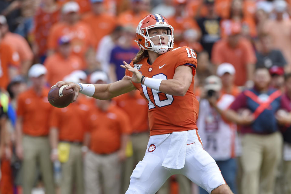 FILE - In this Oct. 12, 2019, file photo, Clemson's Trevor Lawrence throws a pass during the first half of an NCAA college football game against Florida State, in Clemson, S.C. Lawrence has not thrown an interception in his last four games to go with 13 touchdown passes. (AP Photo/Richard Shiro, File)