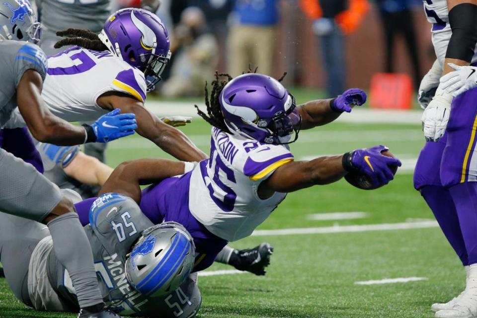 Minnesota Vikings running back Alexander Mattison scores on an 8-yard touchdown run in the third quarter against the Detroit Lions Sunday in Detroit.