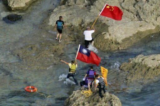 Pro-China activists carrying Chinese and Taiwanese national flags land on the disputed islands in the East China Sea on August 15. Often testy Japan-China ties took a turn for the worse in August when pro-Beijing activists landed on one of the islands