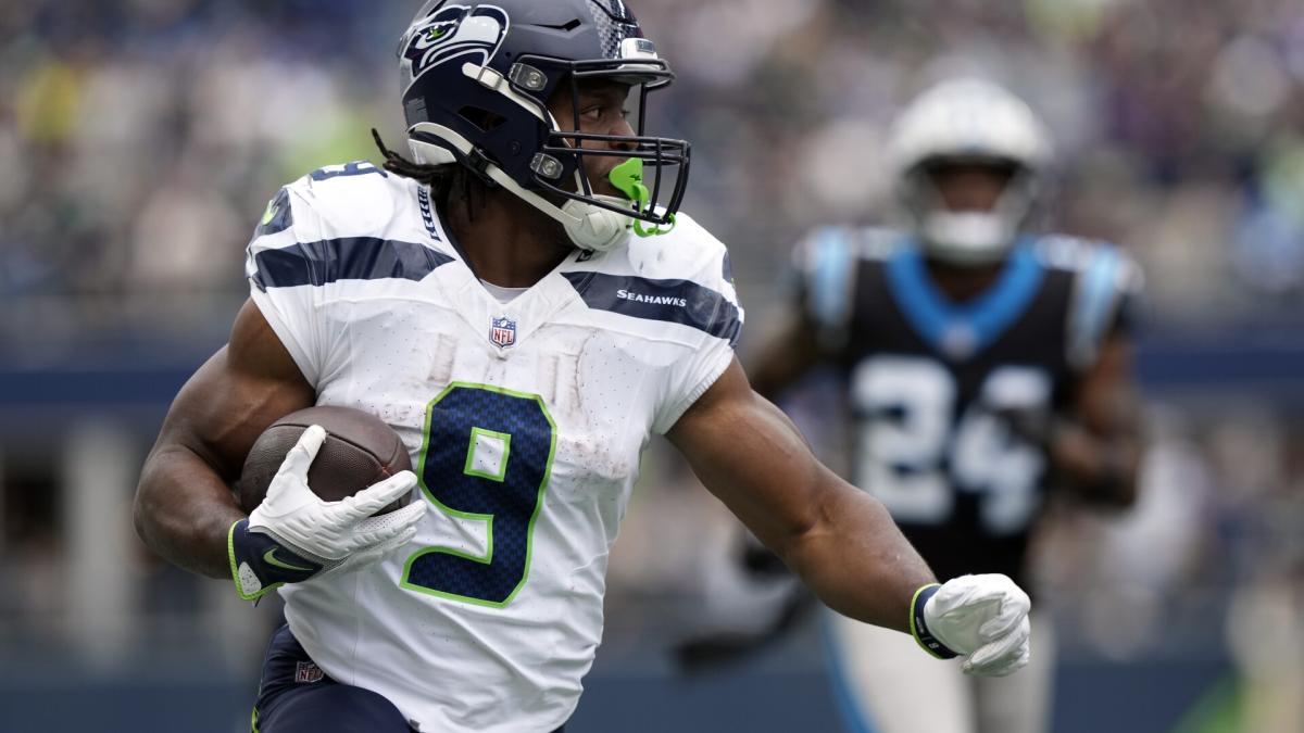 Seattle Seahawks running back Kenneth Walker III powers across the goal  line for a 1-yard TD