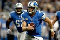 Quarterback Matthew Stafford #12 of the Detroit is chased out of the pocket against the Green Bay Packers at Ford Field on November 18, 2012 in Detroit, Michigan. (Photo by Matthew Stockman/Getty Images)