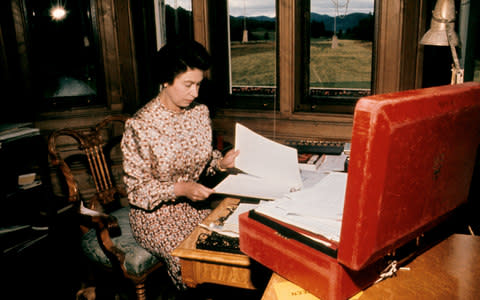 The Queen working at Balmoral - Credit: PA