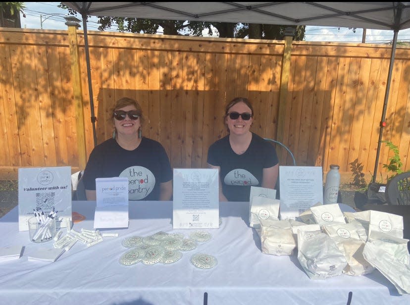 Jill Guinan and a Emily Roper volunteer at Kaleidoscope Youth Center's "Bar-B-Queer" back-to-school bash.