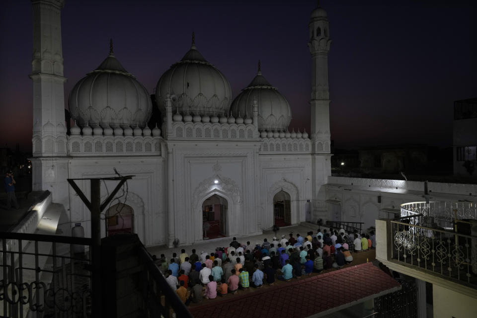 Muslims offer evening prayers before breaking their Ramadan fast at a Mosque, in Ayodhya, India, March 28, 2023. India is home to some two hundred million Muslims who make up the predominantly Hindu country's largest minority group. They are scattered across almost every part of India where a systematic anti-Muslim fury has swept since Prime Minister Narendra Modi first assumed power in 2014. (AP Photo/Manish Swarup)