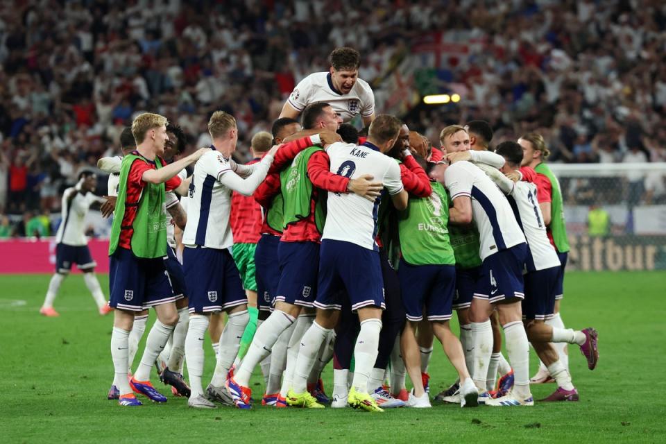 Substitutes spilled onto the pitch after Watkins’s late winner (The FA via Getty)