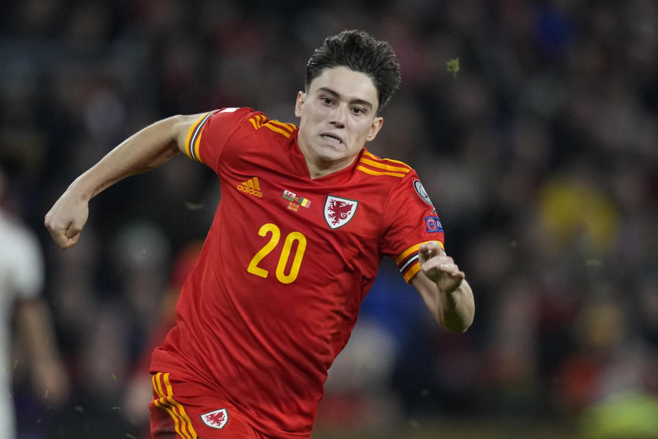 FILE - Wales' Daniel James goes for the ball during the World Cup 2022 group E qualifying soccer match between Wales and Belgium at Cardiff City stadium in Cardiff, Wales, Tuesday, Nov. 16, 2021. (AP Photo/Frank Augstein, File)