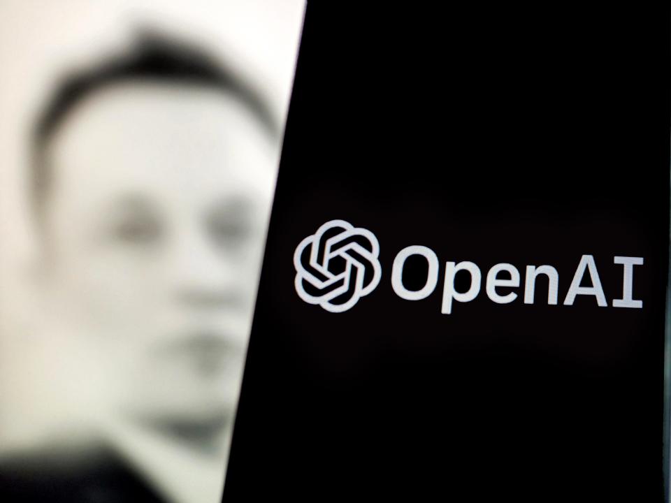 OpenAI logo with shadow of Elon Musk in background